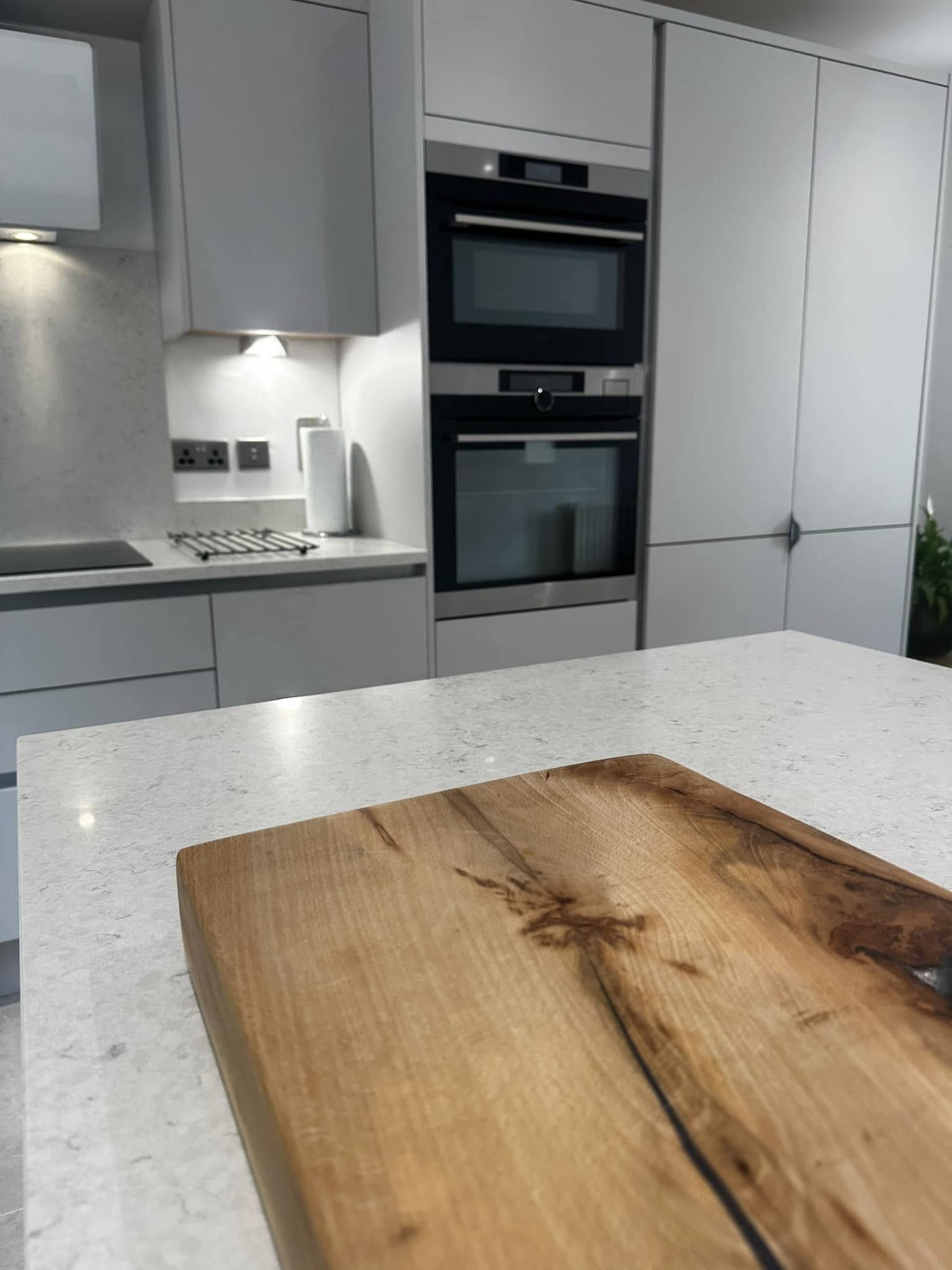 chopping board and view of kitchen