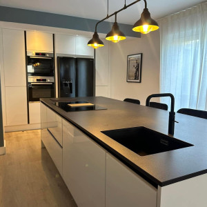 dark colour lights yellow warm glow onto kitchen