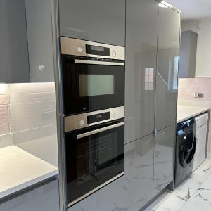 kitchen oven beside cupboards
