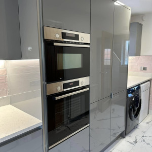 kitchen oven beside cupboards
