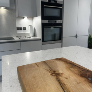 chopping board and view of kitchen