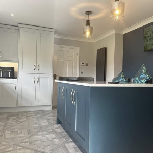 navy kitchen with white cupboards